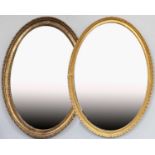 A Near Pair of George III Oval Gilt Framed Mirrors, the largest 40cm by 55cm with modern platethe