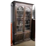 An Oak and Leaded Glazed Bookcase, 104cm by 35cm by 196cm