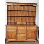 A Late 20th Century Bespoke Made Oak Dresser and Rack, the rack fitted with three small drawers,