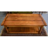 A Bates and Lambourne Reproduction Oak Coffee Table, fitted with two drawers, 152cm by 76cm by 51cm