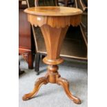 A Victorian Figured Walnut Work Table, with fitted top and on carved scrolled supports, 43cm by
