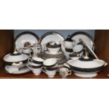 A Royal Doulton ''Carlyle'' Pattern Dinner Service; together with a coffee pot and cup in "Old Leeds