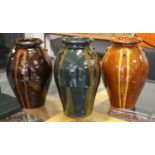 Three Modern Glazed Terracotta Olive Jars, with loop handles, each 43cm high (3)