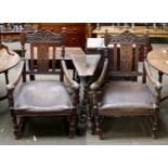 A Pair of 17th Century Style Carved Oak and Open Armchairs, with leaf scrolls and leather seats