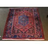 Hamadan Rug, the strawberry field with a lozenge centered by a indigo panel framed by spandrels