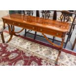 A Reproduction Cross-Banded Mahogany Serving Table, fitted with three frieze drawers, 152cm by