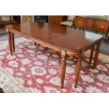A Reproduction Mahogany Dining Table, in Regency style, on reeded tapering legs, 209cm by 124cm by