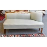 A Small Day Bed, upholstered in duck egg blue, on tapering square section mahogany legs and moving