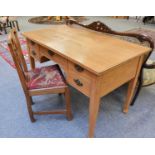 A 1920s Light Oak Five Drawer Desk, on square supports, 126cm by 70cm by 77cm; together with a