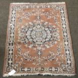 A Qashqai Rug, the blood red field with two medallions enclosed by narrow ivory borders, 153 cm by