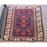 A Bergama Rug, the indigo field with central stepped lozenge and stellar motifs enclosed by leaf and