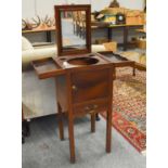 A George III Mahogany Washstand, the square top opening to reveal a lift-out mirror and fitted