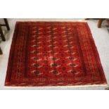 A Tekke Rug, the crimson field of guls enclosed by borders of stellar devices, 192 cm by 137 cm,