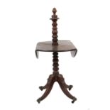 A George IV Mahogany Dropleaf Dumb Waiter, 2nd quarter 19th century, with turned column support