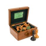 A Staunton Boxwood and Ebony Chess Set, late 19th century, in original box with paper label numbered