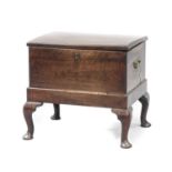 A George III Mahogany Closed Stool, early 19th century, the hinged lid enclosing a vacant