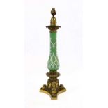 A French Gilt Metal Mounted Green Glass Oil Lamp Base, with leaf-cast captial with white enamel