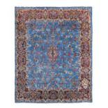 Kirman CarpetSouth East Iran, circa 1940The sky blue field of flowering vines centred by an ivory
