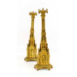 A Pair of Victorian Gilt Metal Pricket Candlesticks, the arcaded drip pans on hexagonal columns with