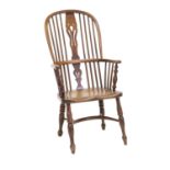 A Mid 19th Century Yewwood, Elm-Seated Double-Spindle-Back Windsor Armchair, with double pierced