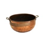 A Late 19th/Early 20th Century Hammered Copper Twin-Handled Log Bin, of circular form and with