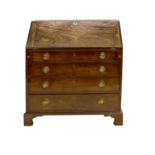A George III Mahogany and Pine-Lined Bureau, late 18th century, the fall front enclosing a fitted