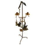 A Wrought Iron Adjustable Candlestand, 18th century, with two sconces on circular drip pans and