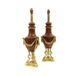 A Pair of Gilt Metal Mounted Rouge Marble Lamp Bases, in Louis XVI style, of urn shape hung with