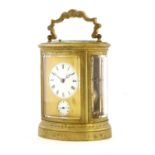 A Brass Oval Shaped Strike and Repeat Alarm Carriage Clock, circa 1880, case elaborately engraved