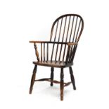 A Mid 19th Century Ash and Elm Spindle-Back Windsor Armchair, the spindle-turned uprights and elm
