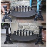 A Pair of Cast Iron Fire Dogs, in 16th century style, with cast ornament on trestle bases, the grate