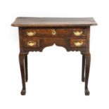 A George II Oak and Mahogany-Crossbanded Side Table, mid 18th century, the moulded top above an