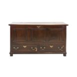 A George III Oak Mule Chest, late 18th century, the boarded hinged lid enclosing a vacant interior