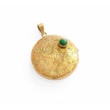 A 9 Carat Gold Locket, the circular engraved locket inset with a green stone, locket measures 3.