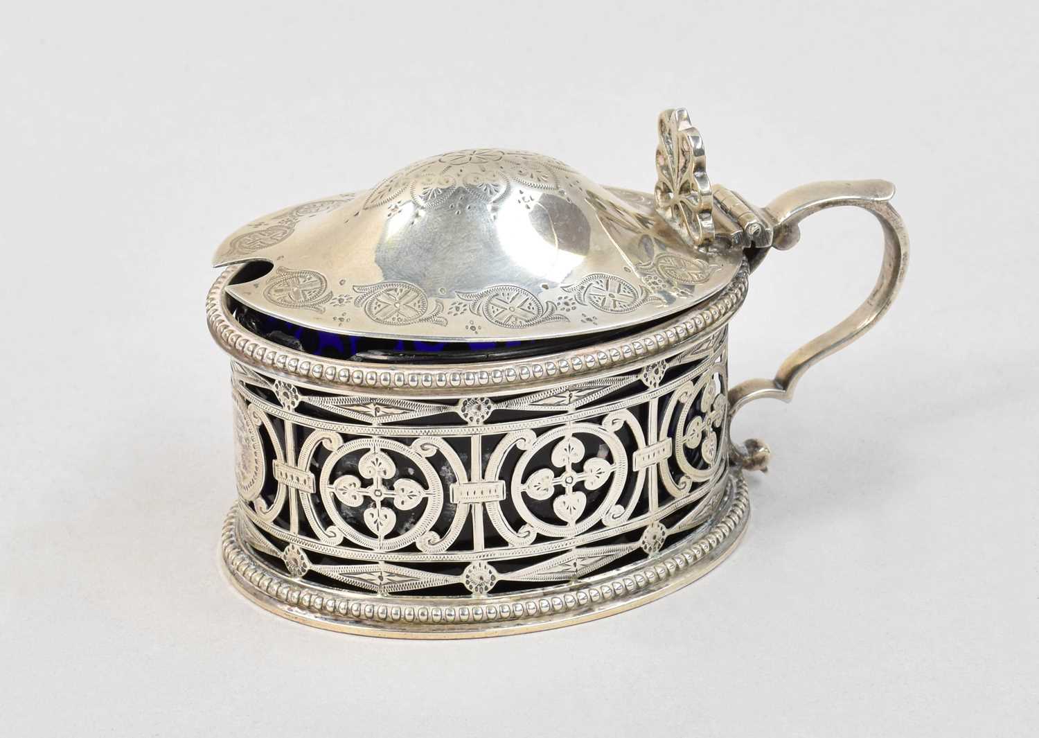 A Victorian Silver Mustard-Pot, by Walter and John Barnard, London, 1880, oval, the sides pierced