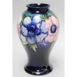 A William Moorcroft Baluster Shaped Vase, decorated in the Enamone pattern on a cobalt blue