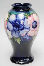 A William Moorcroft Baluster Shaped Vase, decorated in the Enamone pattern on a cobalt blue
