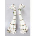 A Pair of Continental Faience Models of Cats, circa 1930s, elongated form and painted with