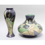 A Moorcroft Black Tulip Pattern Vase, designed by Sally Tuffin, impressed factory marks, 21cm