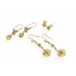 A Pair of Peridot and Seed Pearl Drop Earrings, the round cut peridot within a border of seed