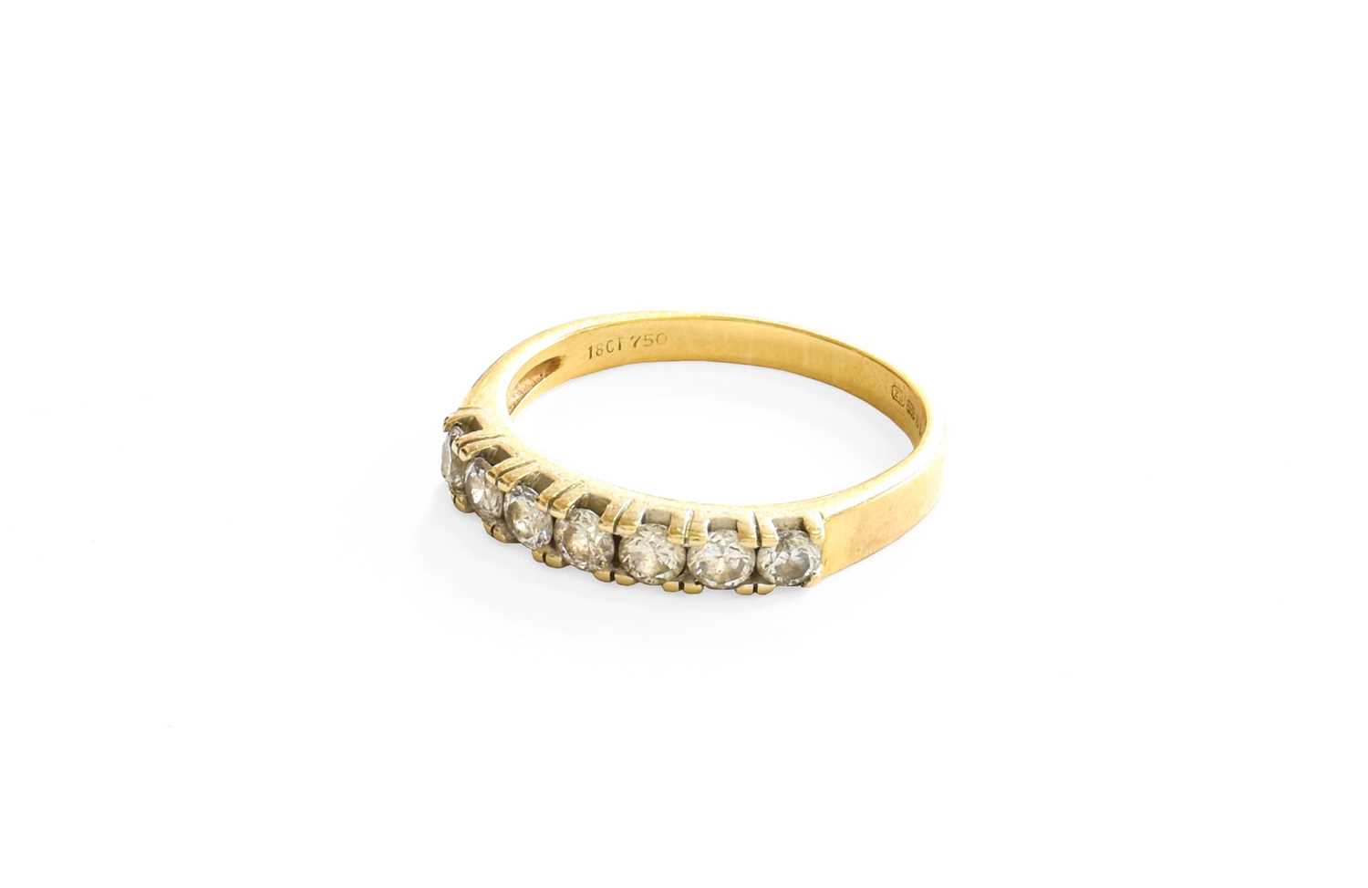 An 18 Carat Gold Diamond Seven Stone Ring, the round brilliant cut diamonds in white claw