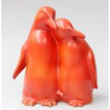 A Royal Doulton Trial Piece, formed as two penguins and in red glaze, 17cmNo damage or repair.