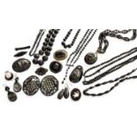 A Quantity of Jet, Bog Oak and Vulcanite Jewellery, including brooches, beads, earrings, a belt