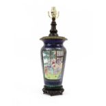 A Canton Enamel Vase, 19th century, painted in famille rose enemals with figures in gardens on a