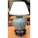 A Modern Chinese Porcelain Crackle Celadan Glazed Table Lamp, on hardwood base and with pleated