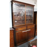 A Large Mahogany Bookcase, early 19th century with drawers to the frieze and having reeded