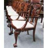 A Set of Eight Reproduction Carved Mahogany Dining Chairs, in Chippendale style, comprising two