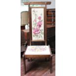 A 20th century Oriental Tall Chair, overhanging top rail, above an upholstered tapestry back and