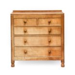 Robert Mouseman Thompson (1876-1955): An English Oak Panelled Chest of Drawers, with raised