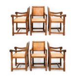 Robert Mouseman Thompson (1876-1955): A Set of Six English Oak Panel Back Arm Chairs, upholstered